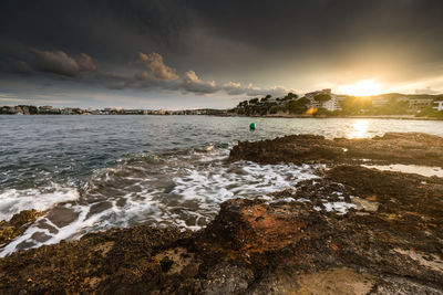 Scenic view of sea against sky during sunset