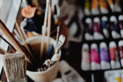 Close-up of paintbrushes on table