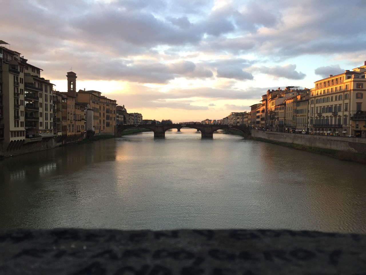 architecture, built structure, building exterior, sky, water, city, river, bridge - man made structure, connection, cloud - sky, outdoors, sunset, travel destinations, no people, cityscape, day