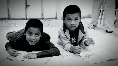 Portrait of siblings playing at home