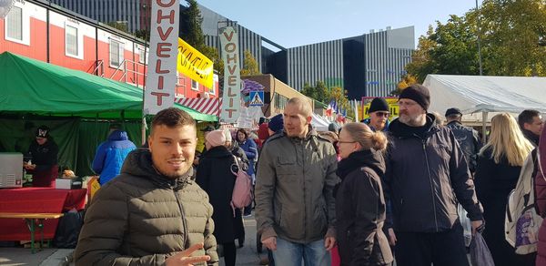 People standing on street in city