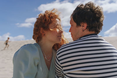 Side view of woman looking at beach