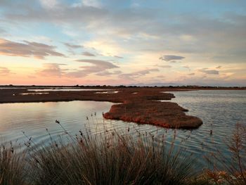 Scenic view of sea against sky at sunset