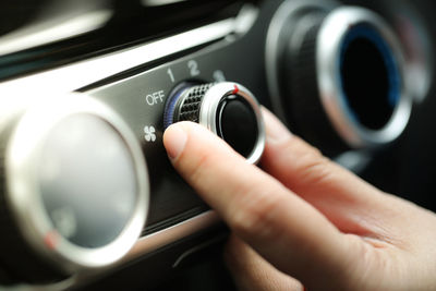 Close-up of hand holding car