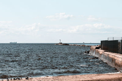 Scenic view of sea against sky,coastal lighthouse element, signs, light