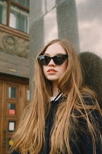 Portrait of young woman wearing sunglasses