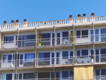 Low angle view of building against clear blue sky