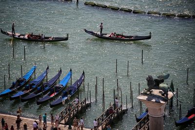 High angle view of people on boats in canal