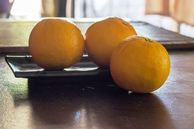 Close-up of oranges on table