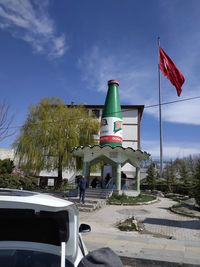 View of flag on road against sky