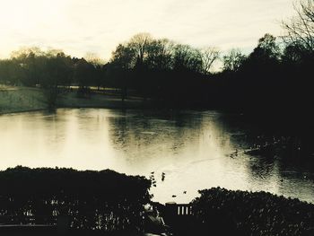 Scenic view of lake against sky during sunset