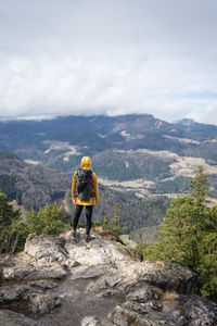 Rear view of man walking on mountain