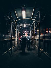 Blurred motion of man walking in tunnel