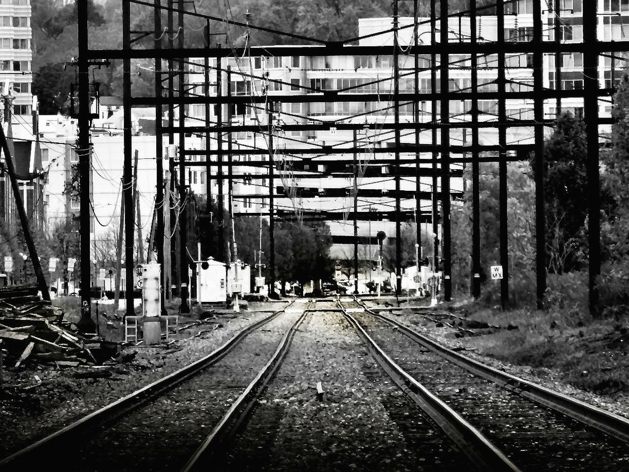 railroad track, transportation, rail transportation, public transportation, the way forward, diminishing perspective, railway track, built structure, railroad station platform, architecture, railroad station, building exterior, vanishing point, train - vehicle, mode of transport, day, tree, city, train, travel