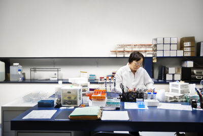 Portrait of female doctor working in office