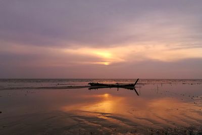 Scenic view of sea against sky at sunset