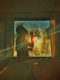 Reflection of woman in glass window