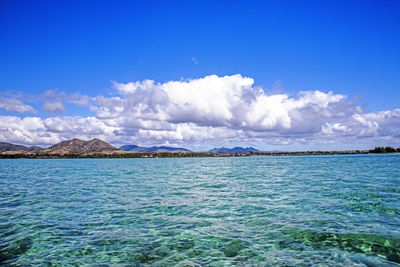 Scenic view of sea against blue sky