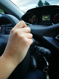 Close-up of hand holding car