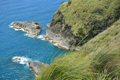 High angle view of rocks by sea