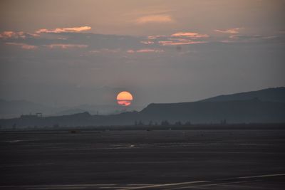 Scenic view of landscape against sky during sunset