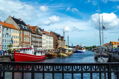 Boats moored at harbor