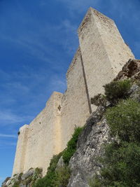 Low angle view of building against blue sky