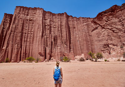 Woman standing for talampaya canyon national park