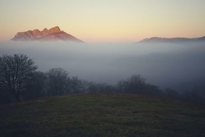 Scenic view of mountains against sky during sunset