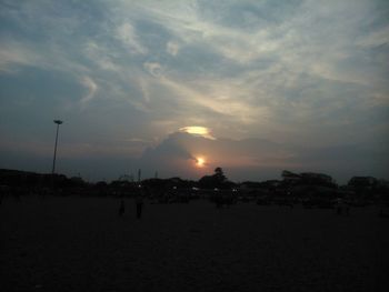 Scenic view of landscape against cloudy sky