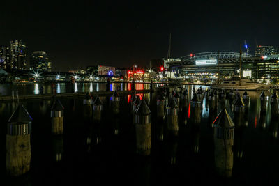 Reflection of illuminated buildings in river at night