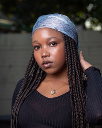 Portrait of beautiful young woman standing outdoors. simple professional work from the photographer.