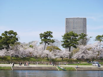 Low angle view of built structures against clear blue sky