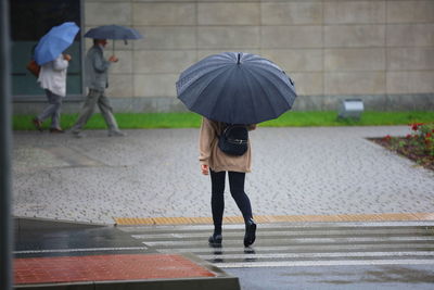 Full length of woman walking on street