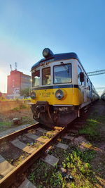 Train on railroad track against sky