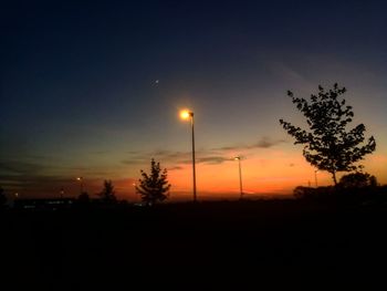 Silhouette trees against sky during sunset