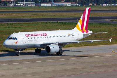 View of airplane at airport runway