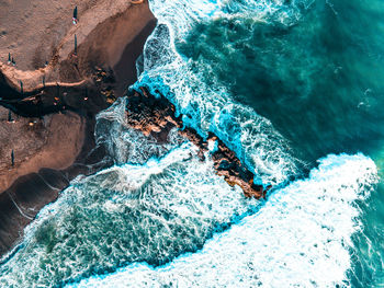 High angle view of rocks in sea