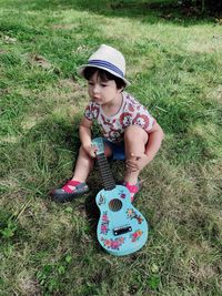 Full length of boy wearing hat on field