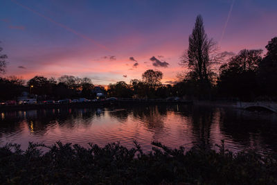 Scenic view of lake against romantic sky at sunset