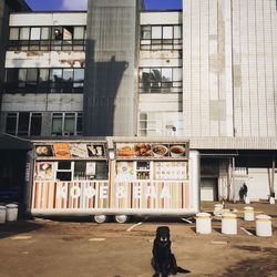 Woman standing in front of building