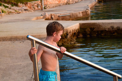 Boy playing in lake