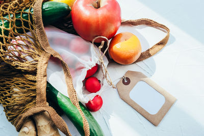 High angle view of fruits in basket on table