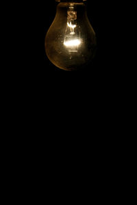 Low angle view of illuminated light bulb