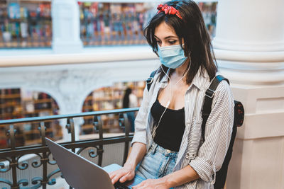 Young woman using laptop at home