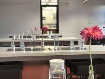 Flower vase on table in restaurant