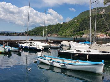 Boats moored at harbor