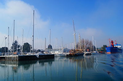 Boats moored at harbor