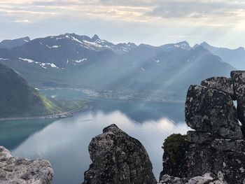 Scenic view of lake and mountains against sky