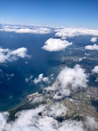 Aerial view of clouds over landscape against sky